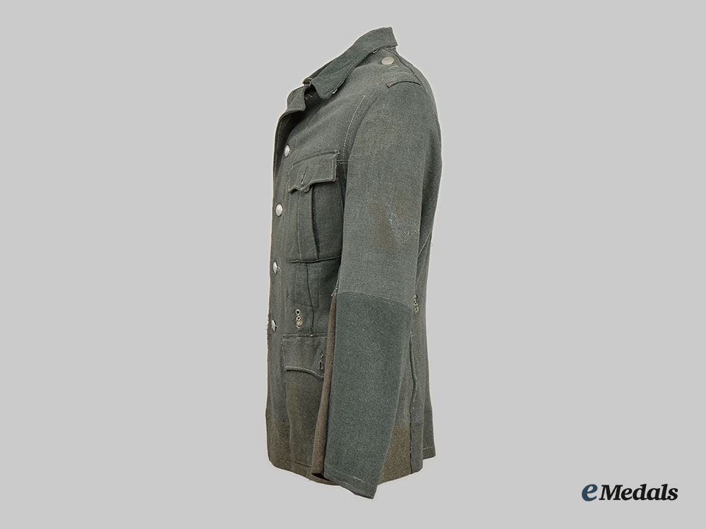 germany,_wehrmacht._a_late_war_de-_badged_uniform_tunic__l22__m_n_c0976_740