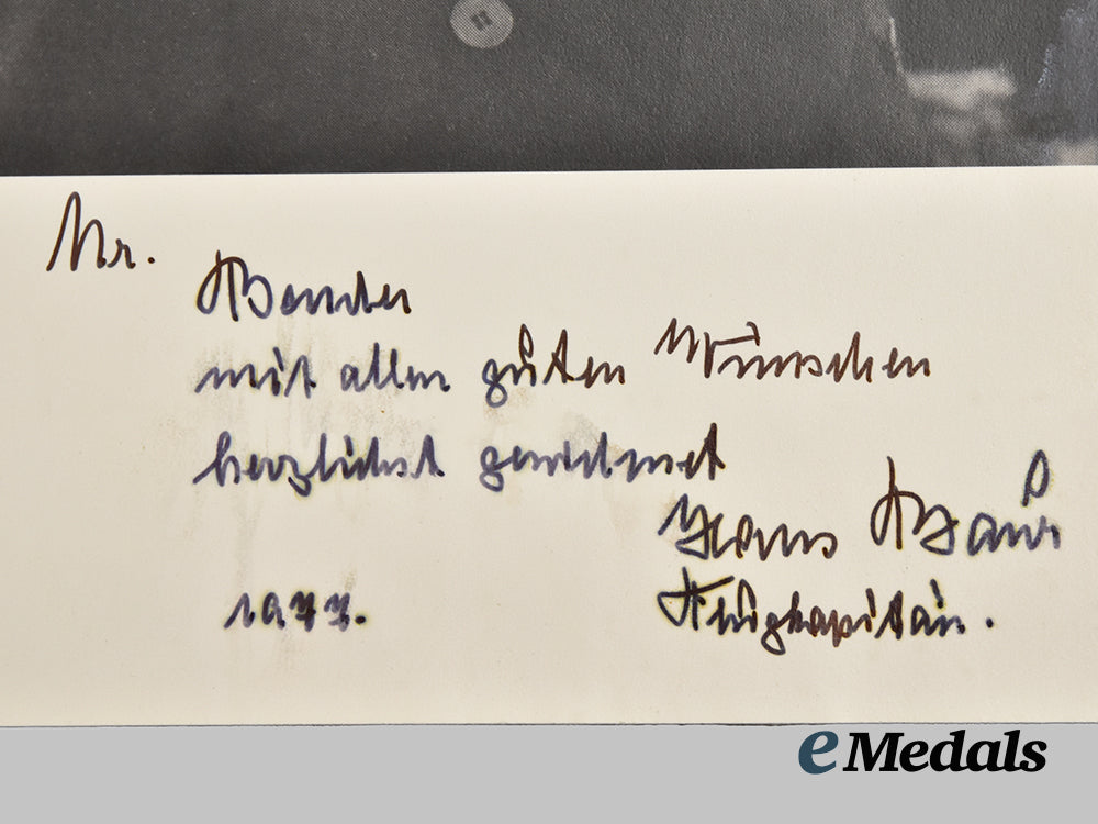 germany,_third_reich._a_pair_of_post-_war_signed_photographs_of_a_h_personal_pilot_hans_bauer,_dedicated_to_roger_j._bender___m_n_c0012
