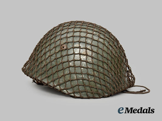 italy,_kingdom._an_m33_steel_helmet,_owner-_attributed,_with_net___m_n_c0060