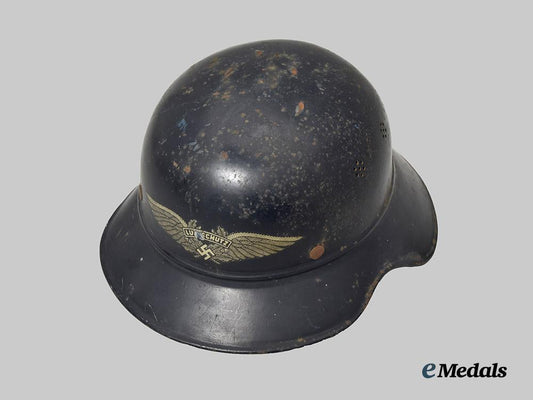 germany,_third_reich._a_luftschutz_gladiator_helmet,_owner-_attributed_one-_piece_version,_by_f._w._quist___m_n_c0139