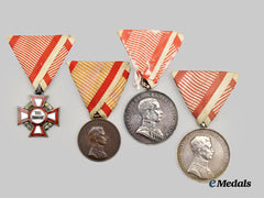 Austria, Imperial. A Military Merit Cross, III Class and Three Bravery Medals