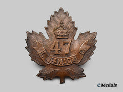 Canada, CEF. A 47th Infantry Battalion Cap Badge, Type I with Regular Leaf bearing a wide "47"