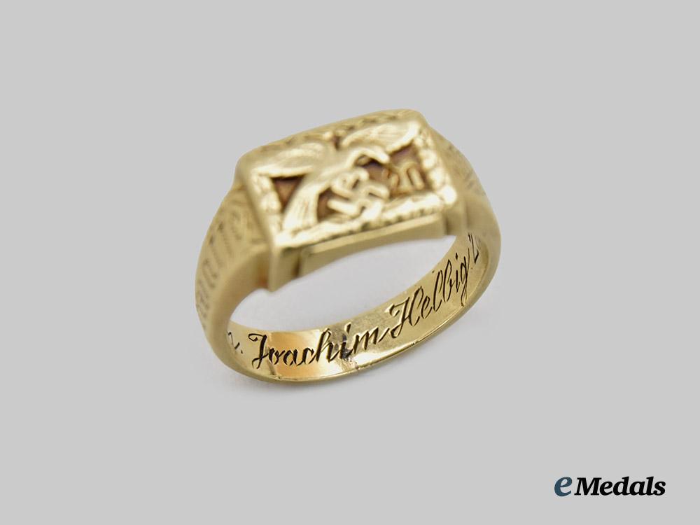 germany,_luftwaffe._a14kt_gold_luftwaffe_ring_belonging_to_knight’s_cross_recipient_hauptmann_helbig_accompanied_by_a_signed_studio_photograph___m_n_c0850