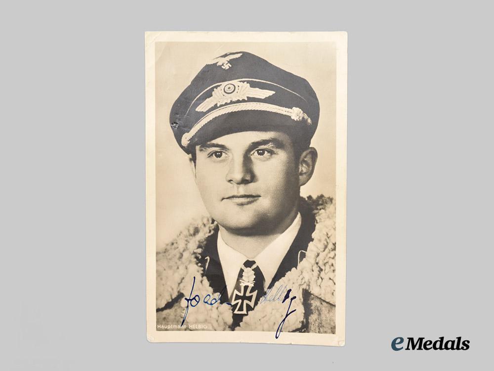 germany,_luftwaffe._a14kt_gold_luftwaffe_ring_belonging_to_knight’s_cross_recipient_hauptmann_helbig_accompanied_by_a_signed_studio_photograph___m_n_c0854