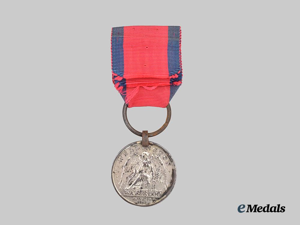 united_kingdom._a_waterloo_medal_to_private_william_holmes,15th_kings_hussars___m_n_c0947