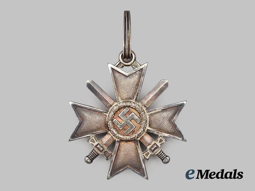 germany,_wehrmacht._a_rare_knight’s_cross_of_the_war_merit_cross_with_swords,_by_deschler&_sohn___m_n_c1099