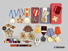 Australia, Bulgaria, Finland, France, Iran, Ivory Coast, Poland, Romania, United Kingdom, United States, Yugoslavia. Lot of Twelve Medals and Ten Assorted Badges and Ribbon Bars
