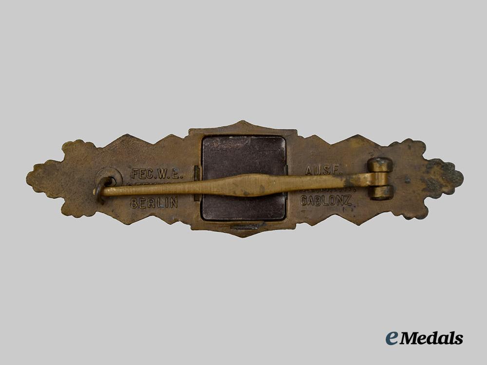 germany,_wehrmacht._a_close_combat_clasp,_first_pattern_large_font_variant,_by_a._g._m.u._k___m_n_c1434