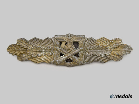 germany,_third_reich._a_close_combat_clasp,_gold_grade,2nd_pattern,_by_rudolf_souval,“_fat_bellied_pin&_thickwire_catch”_version___m_n_c2517
