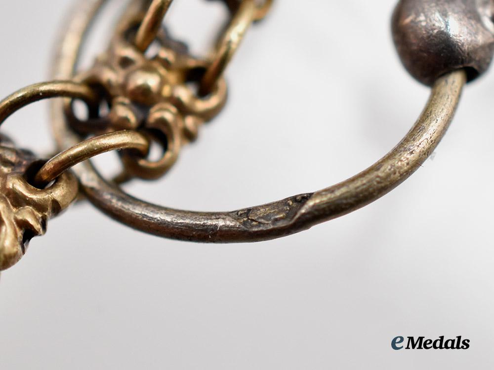 austria,_imperial._a_fine_chain_of_miniature_imperial_orders_by_vincent_mayer,_in_gold,_with_case___m_n_c3103