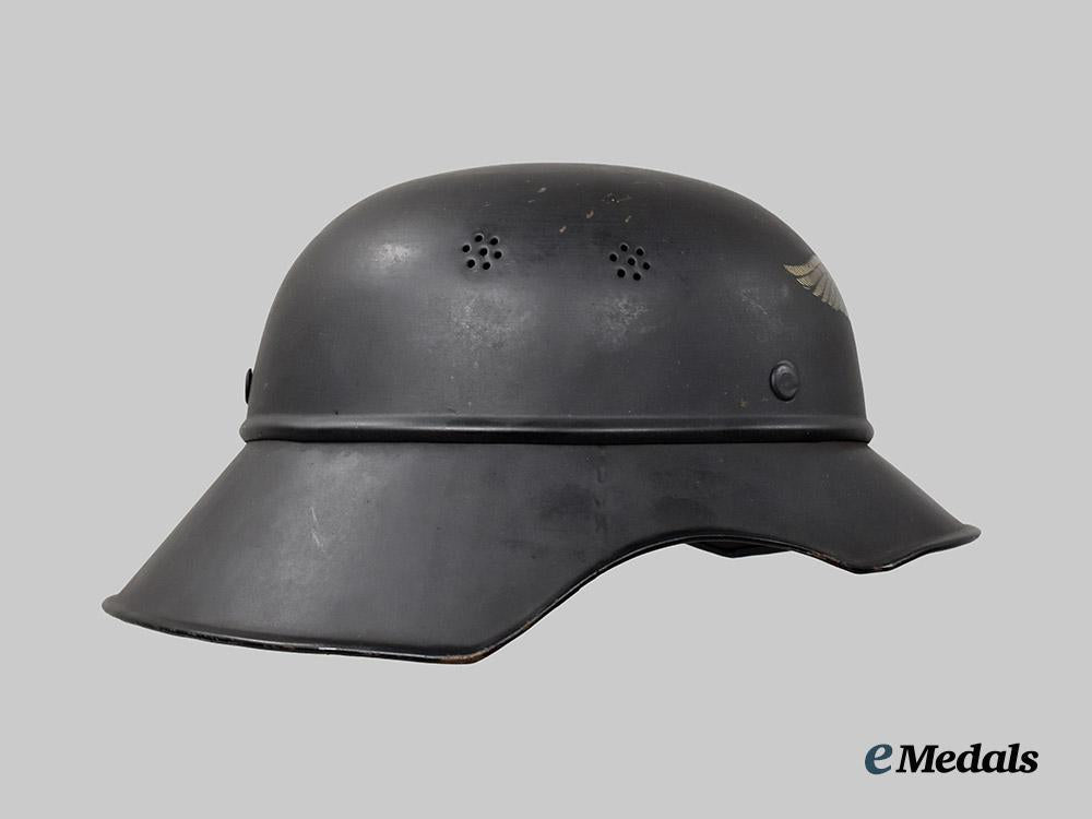 germany,_third_reich._a_luftschutz_gladiator_helmet,_three-_piece_version,_by_paul_diener___m_n_c3114