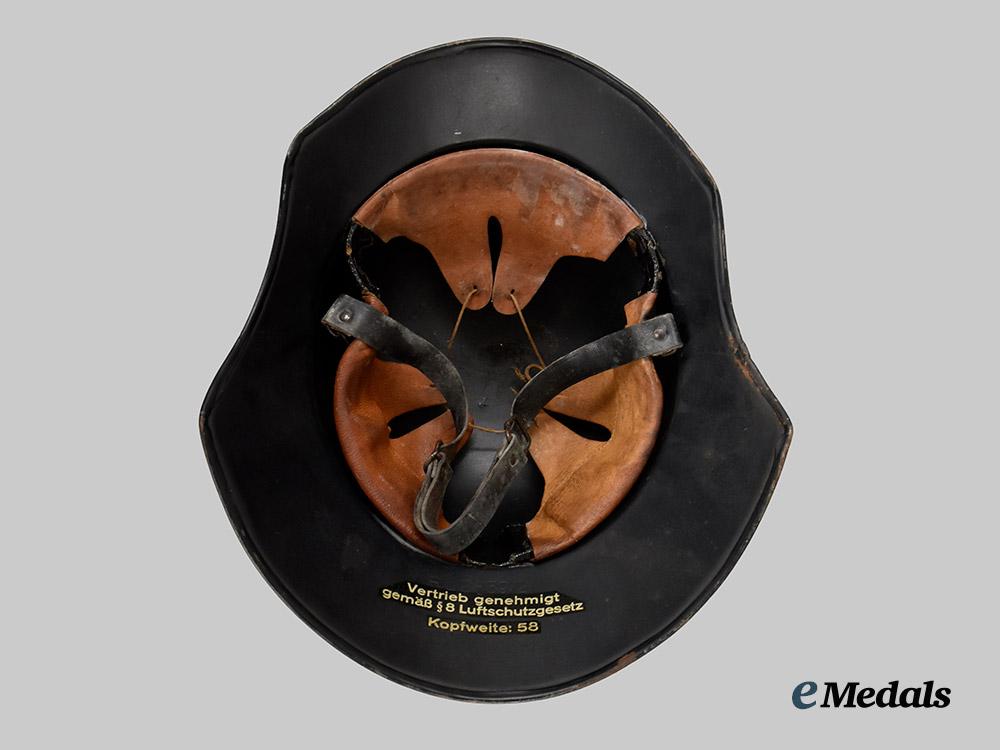 germany,_third_reich._a_luftschutz_gladiator_helmet,_three-_piece_version,_by_paul_diener___m_n_c3117