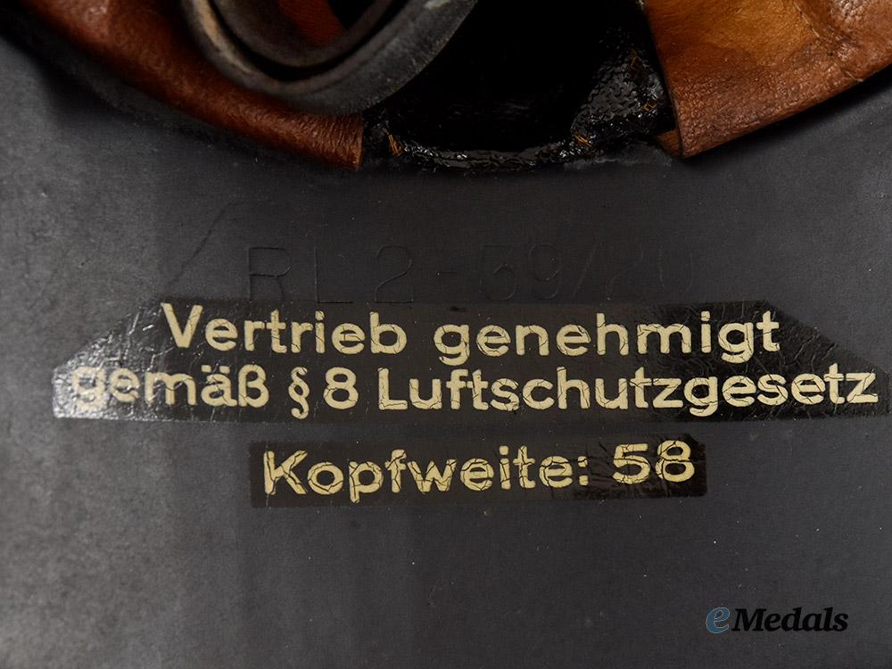 germany,_third_reich._a_luftschutz_gladiator_helmet,_three-_piece_version,_by_paul_diener___m_n_c3118