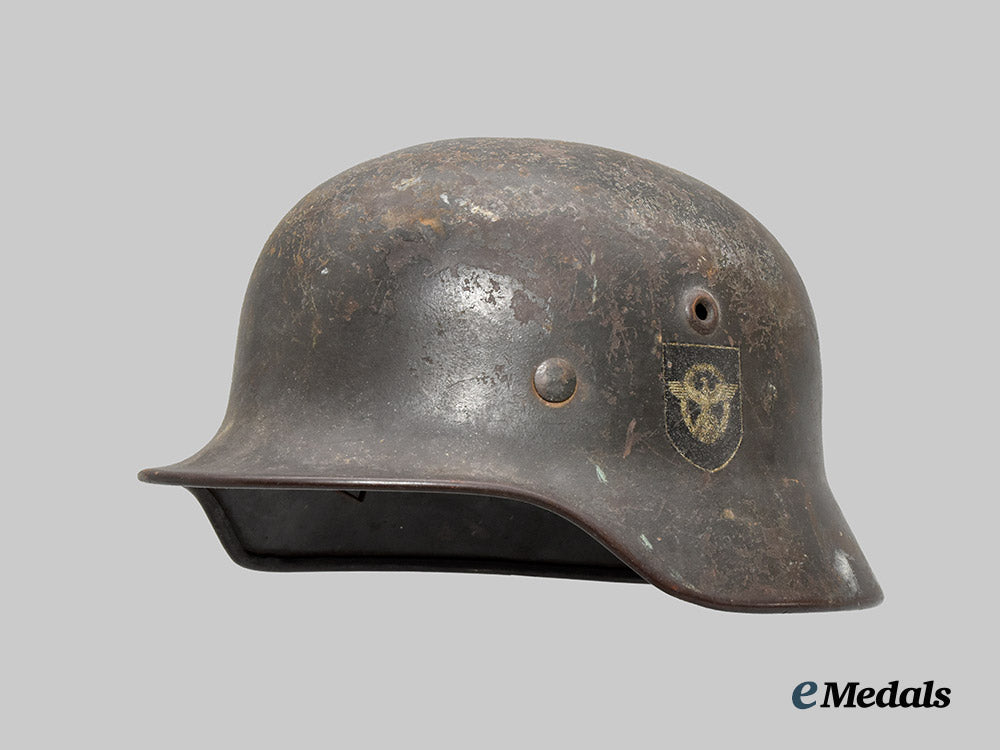 germany,_ordnungspolizei._an_m40_stahlhelm,_double_decal_and_owner-_attributed_example,_by_f._w._quist___m_n_c3130
