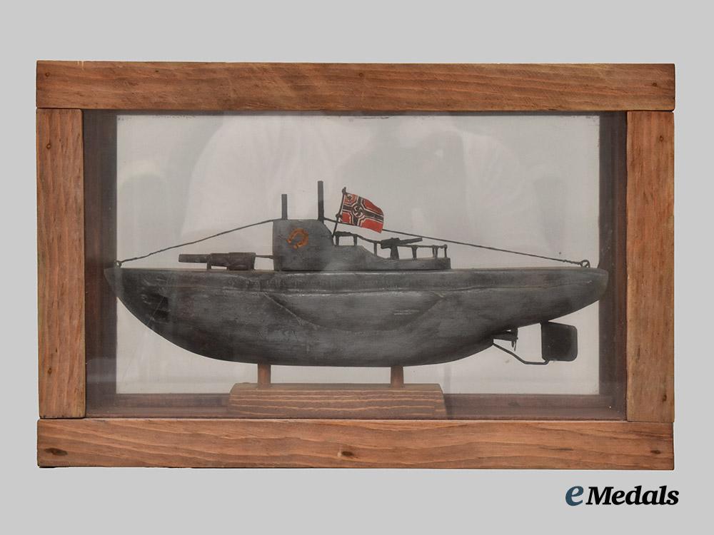 germany,_kriegsmarine._a_cased_model_of_u-99_carved_by_an_inmate_of_bowmanville_p_o_w_camp___m_n_c3212
