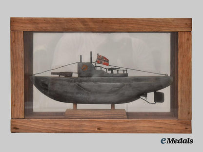germany,_kriegsmarine._a_cased_model_of_u-99_carved_by_an_inmate_of_bowmanville_p_o_w_camp___m_n_c3212