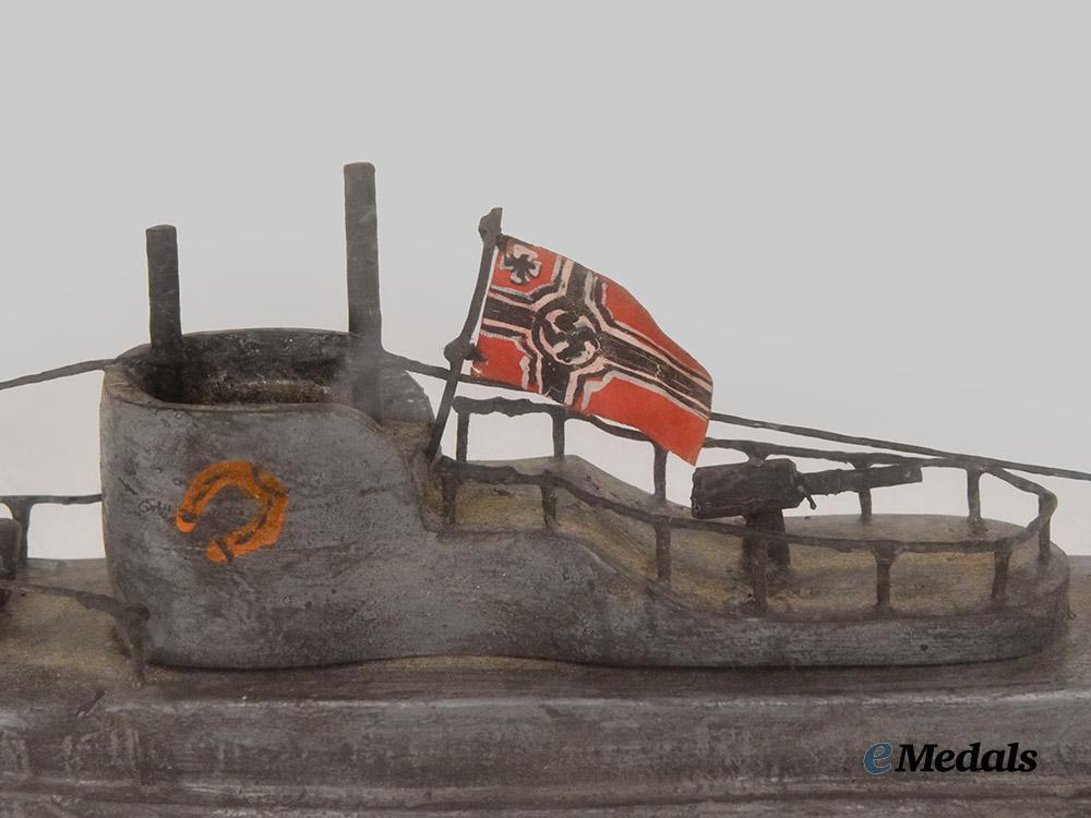 germany,_kriegsmarine._a_cased_model_of_u-99_carved_by_an_inmate_of_bowmanville_p_o_w_camp___m_n_c3213