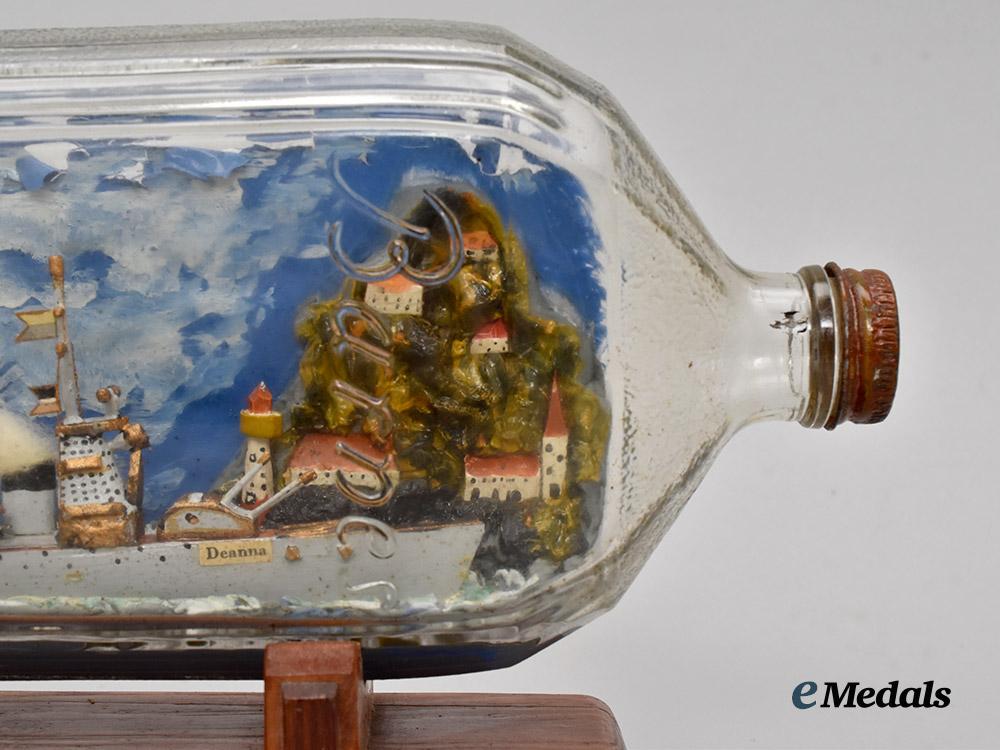 germany,_kriegsmarine._a_ship_in_a_bottle_crafted_by_a_german_p_o_w_in_canadian_custody___m_n_c3225