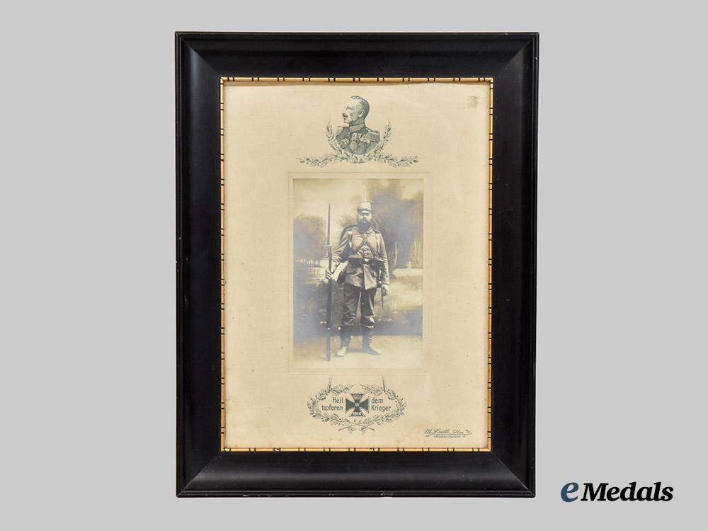 germany,_imperial._a_large_framed_wartime_portrait_of_a_decorated_bavarian_solder_in_full_kit___m_n_c3937