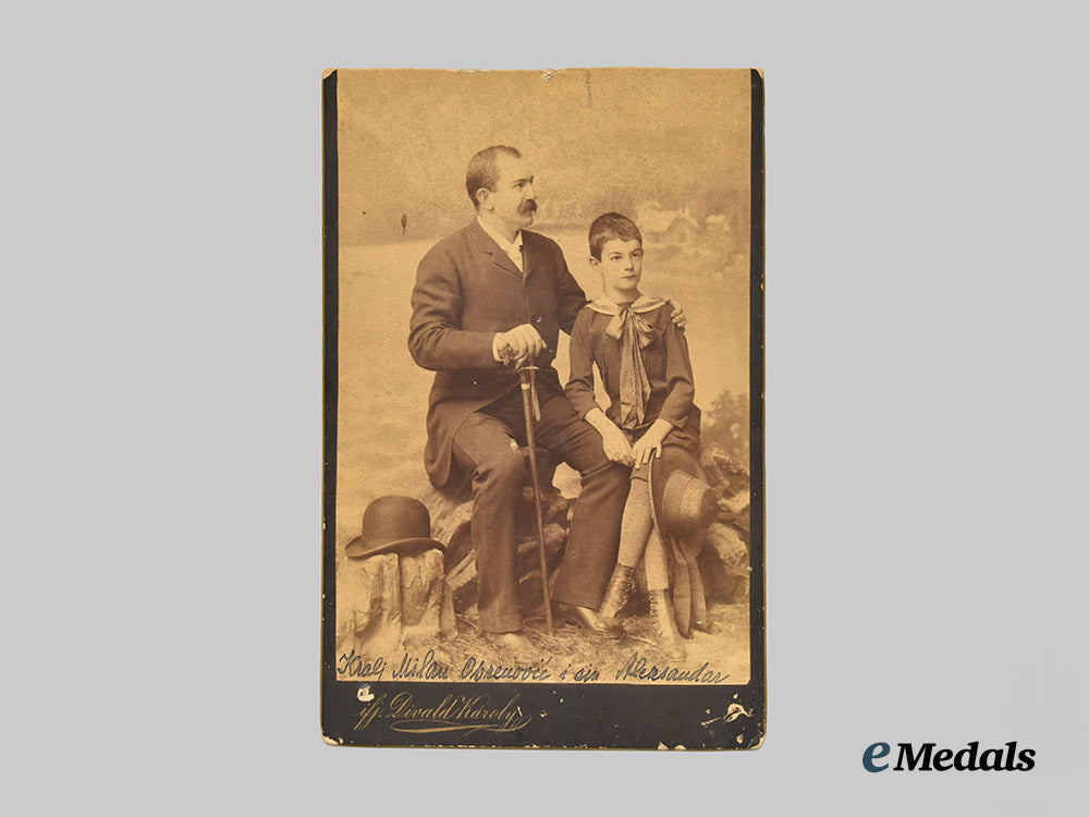 serbia,_kingdom._a_photograph_of_king_milan_i_of_serbia_with_his_son_and_future_king_alexander_i,_c.1888___m_n_c4444