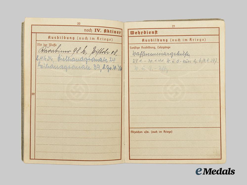 germany,_heer._a_pair_of_wehrpässe,_unissued_and_decorated_eastern_front_service___m_n_c4668