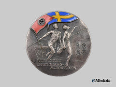 Germany, Third Reich. A 1937 Germany-Sweden Athletics Competition Commemorative Badge, by Deschler & Sohn