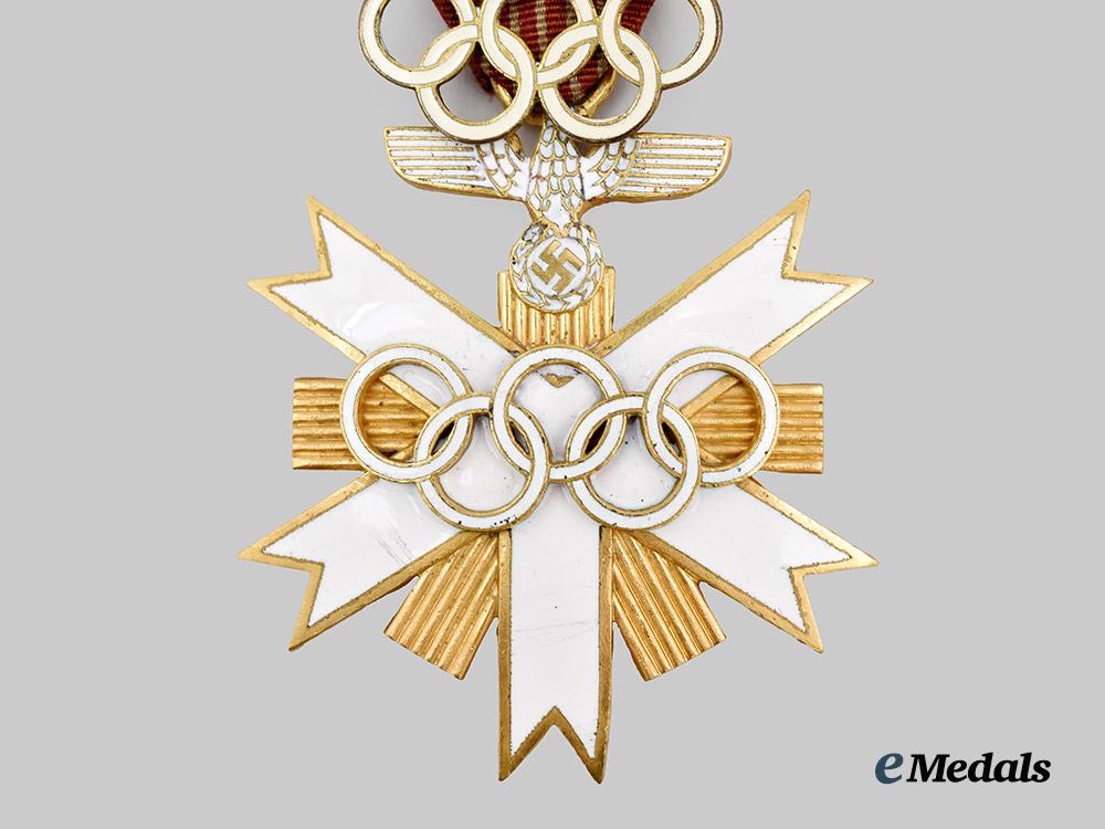 germany,_third_reich._a_rare_olympic_games_decoration,_i_i_class_with_visitor’s_badge,_by_godet___m_n_c4836-_recovered