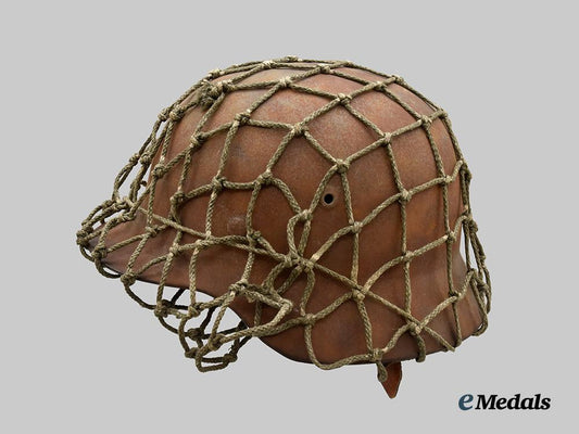 germany,_heer._an_m40_stahlhelm,_with_field-_added_camouflage_netting___m_n_c4996