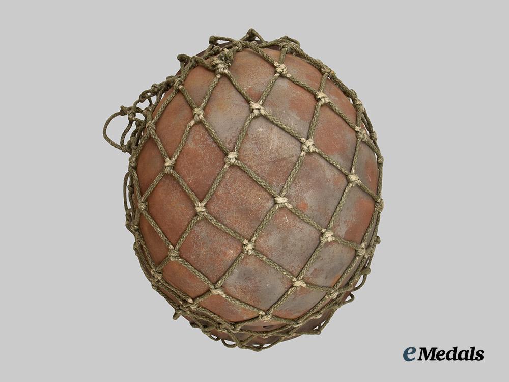 germany,_heer._an_m40_stahlhelm,_with_field-_added_camouflage_netting___m_n_c5001