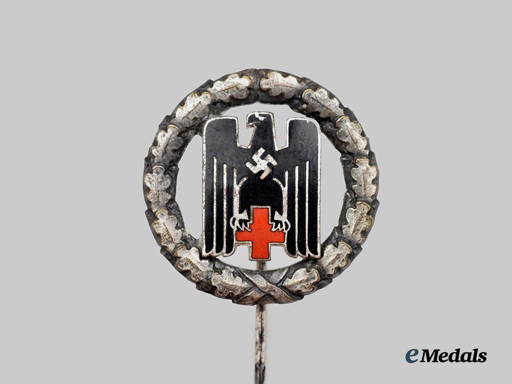 germany,_third_reich._a_german_red_cross_honour_badge,_stick_pin_variant_by_c._e._juncker_of_berlin___m_n_c5223