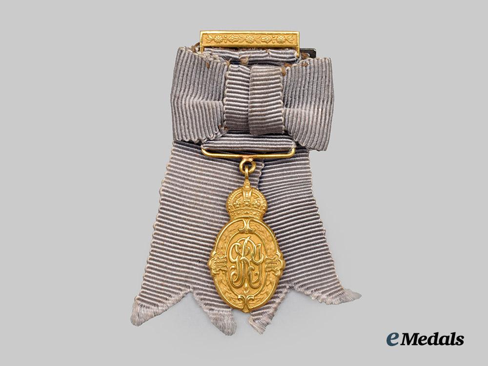 india,_british_raj._a_miniature_kaisar-i-_hind_medal_for_public_service_in_india,_i._class_in22kt_gold_for_dames___m_n_c5244
