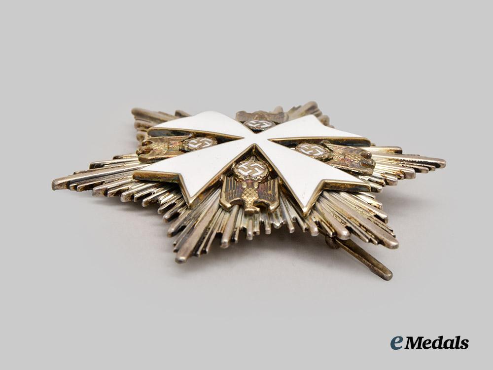 germany,_third_reich._an_order_of_the_german_eagle,_i_i_class_cross_with_breast_star_and_case,_by_gebrüder_godet___m_n_c5249