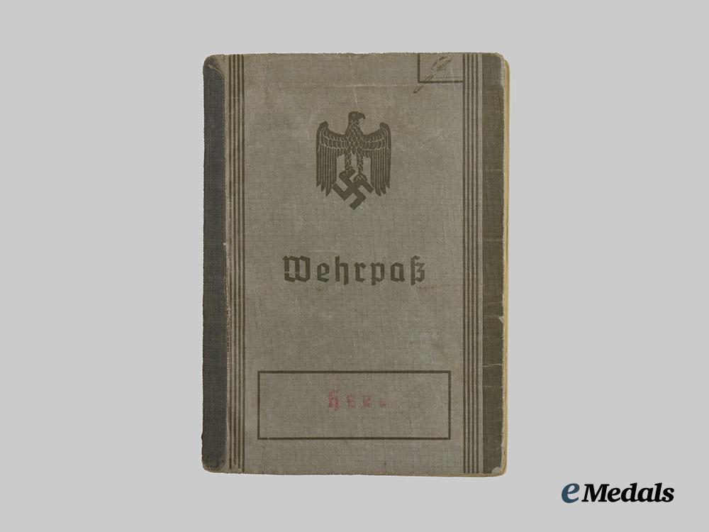 germany,_wehrmacht._a_mixed_lot_of_service_books_to_decorated_eastern_and_western_front_combatants___m_n_c5457