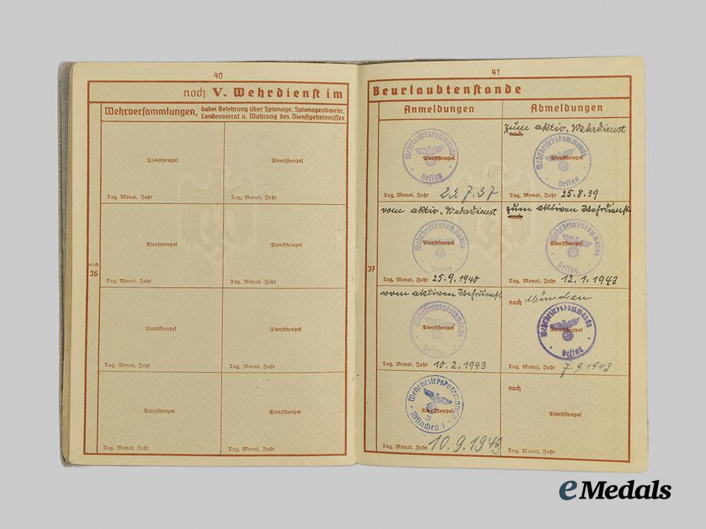 germany,_wehrmacht._a_mixed_lot_of_service_books_to_decorated_eastern_and_western_front_combatants___m_n_c5464