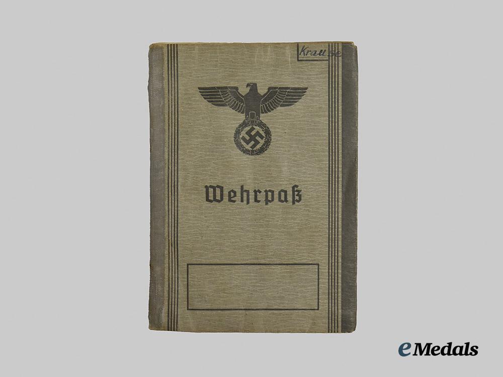 germany,_wehrmacht._a_mixed_lot_of_service_books_to_decorated_eastern_and_western_front_combatants___m_n_c5477