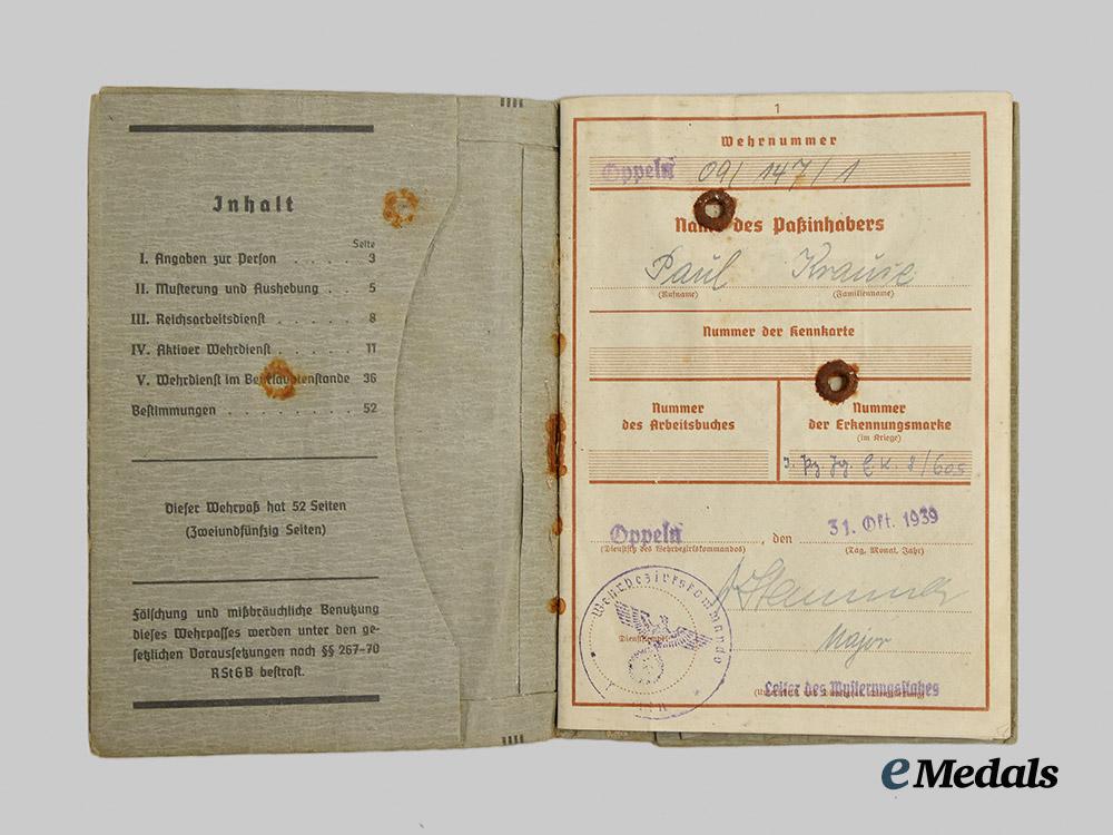 germany,_wehrmacht._a_mixed_lot_of_service_books_to_decorated_eastern_and_western_front_combatants___m_n_c5478