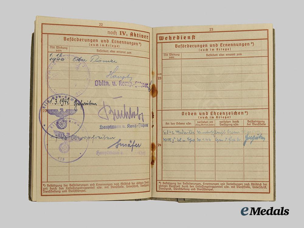 germany,_wehrmacht._a_mixed_lot_of_service_books_to_decorated_eastern_and_western_front_combatants___m_n_c5481