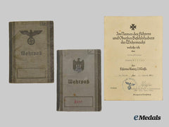 Germany, Heer. A Pair of Wehrpässe, NSDAP Member and Iron Cross Recipient
