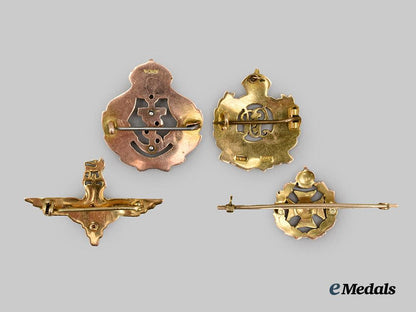 united_kingdom._four_military_service_badges_in9_kt._gold___m_n_c5925