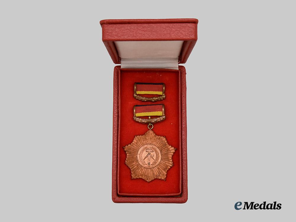 germany,_democratic_republic._a_patriotic_order_of_merit,_bronze_grade_with_case_and_award_document_to_rudi_höllering___m_n_c6225