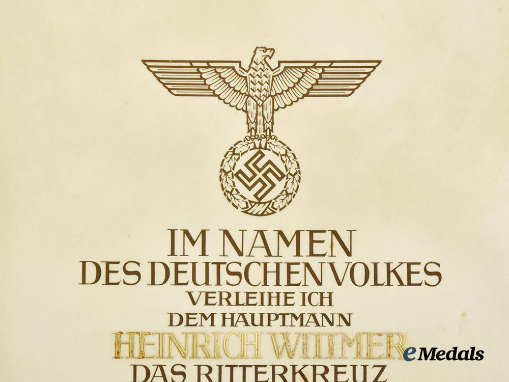 germany,_luftwaffe._a_formal_knight’s_cross_of_the_iron_cross_award_document_to_hauptmann_heinrich_wittmer,_kampfgeschwader55___m_n_c7073