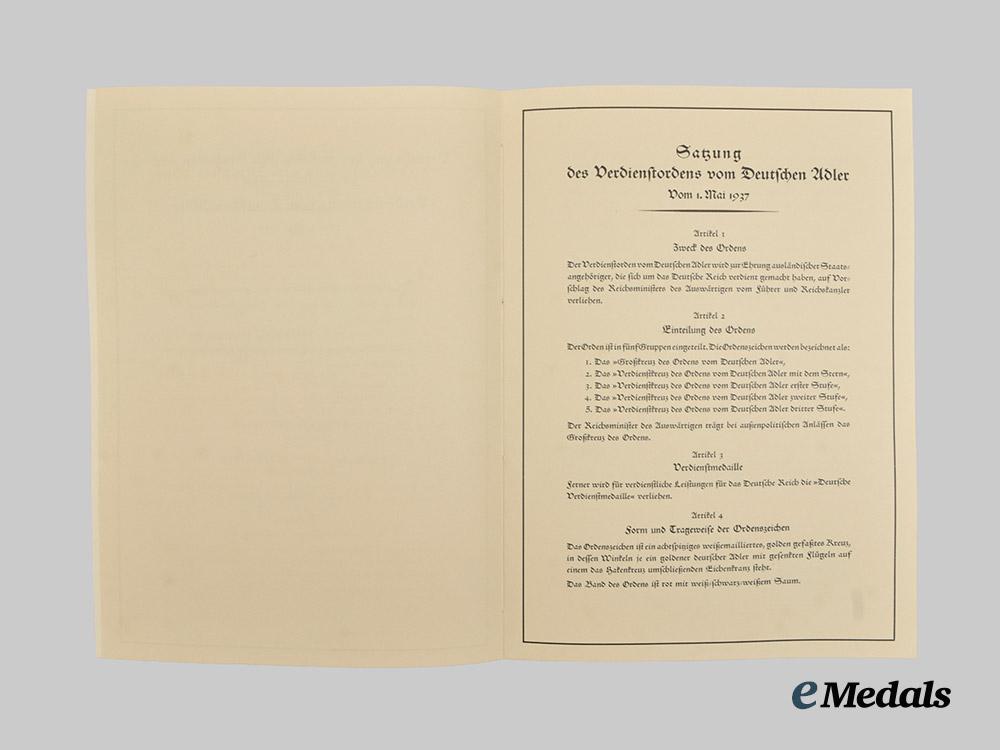 germany,_third_reich._the_statutes_and_award_document_for_an_order_of_the_german_eagle,_i_i_class_cross_with_breast_star,_to_ivo_bagli___m_n_c7097
