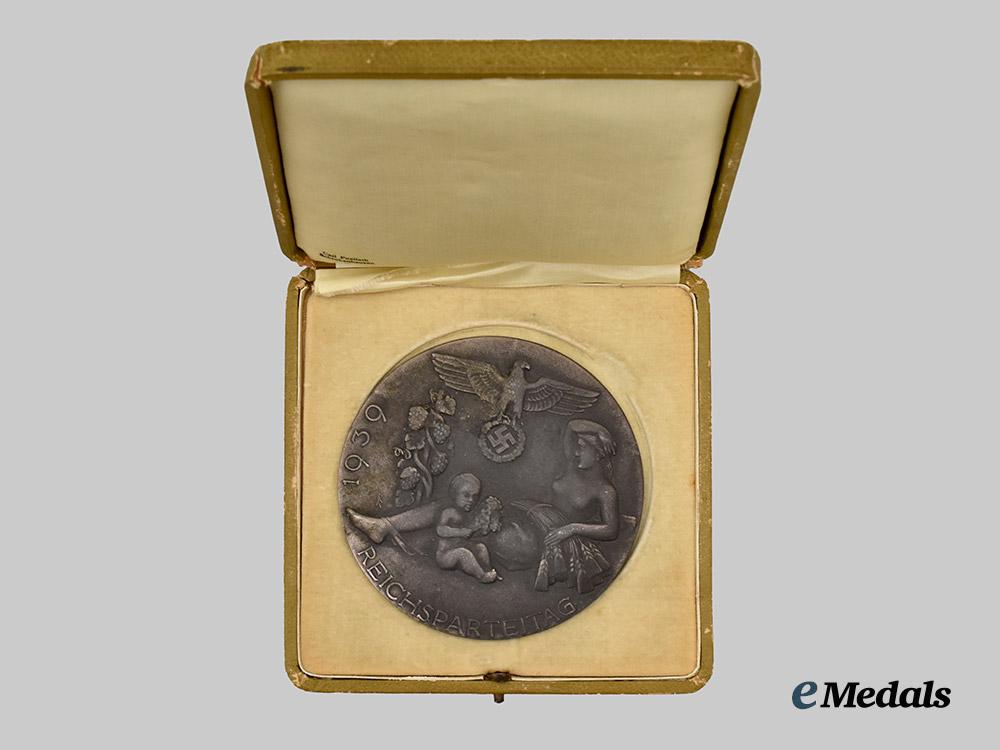 germany,_n_s_d_a_p._a1939_nuremberg_rally_sports_games_second_place_victor’s_plaque,_with_case,_by_carl_poellath___m_n_c7852