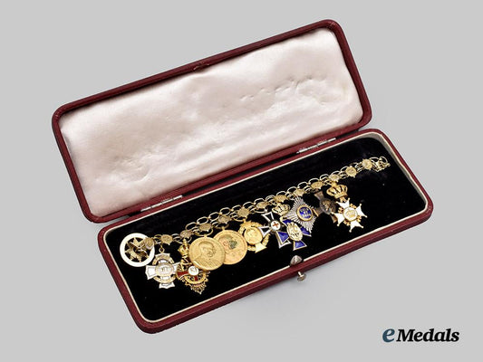 austria,_imperial._a_fine_cased_miniature_order_chain_with_ten_orders,_medals,_and_decorations,_c.1900,_by_brüder_schneider_a_g_of_vienna___m_n_c8027