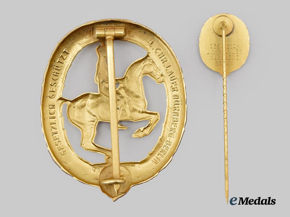germany,_third_reich._a_rare_and_mint_german_horseman’s_badge,_gold_grade_with_miniature_and_case,_by_l._christian_lauer___m_n_c8269