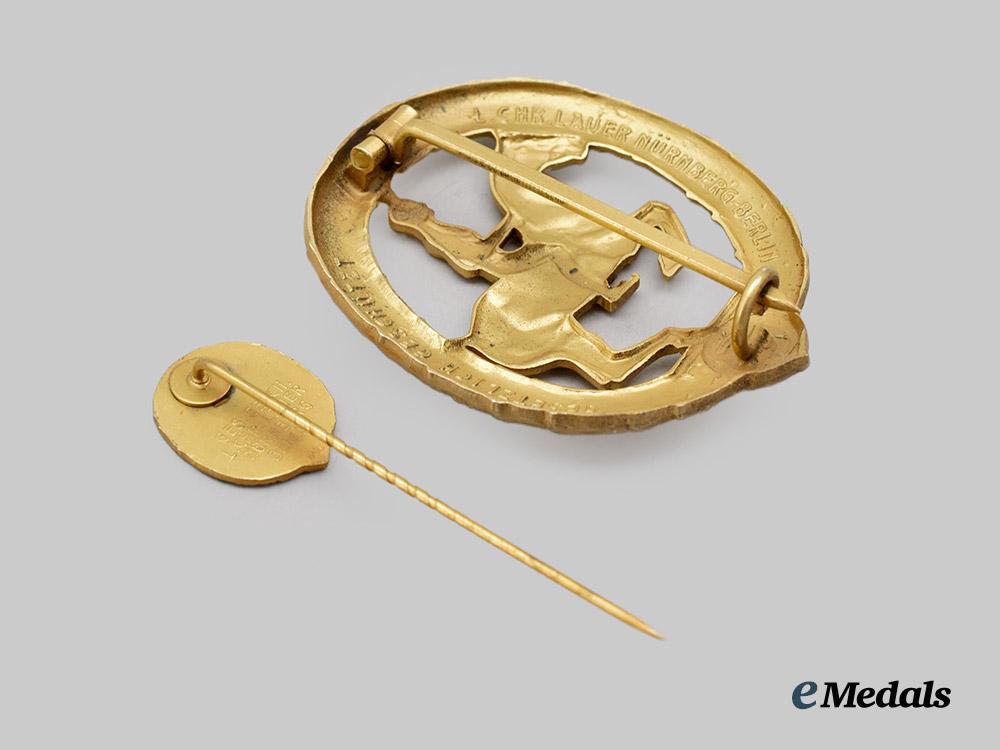 germany,_third_reich._a_rare_and_mint_german_horseman’s_badge,_gold_grade_with_miniature_and_case,_by_l._christian_lauer___m_n_c8270