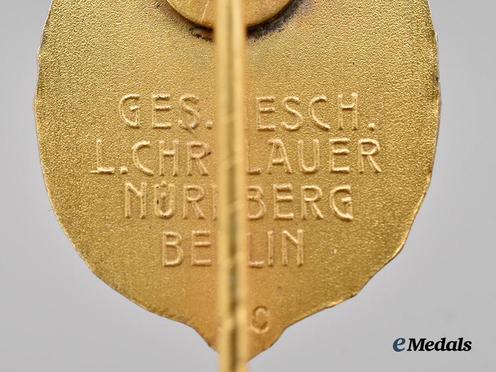 germany,_third_reich._a_rare_and_mint_german_horseman’s_badge,_gold_grade_with_miniature_and_case,_by_l._christian_lauer___m_n_c8272