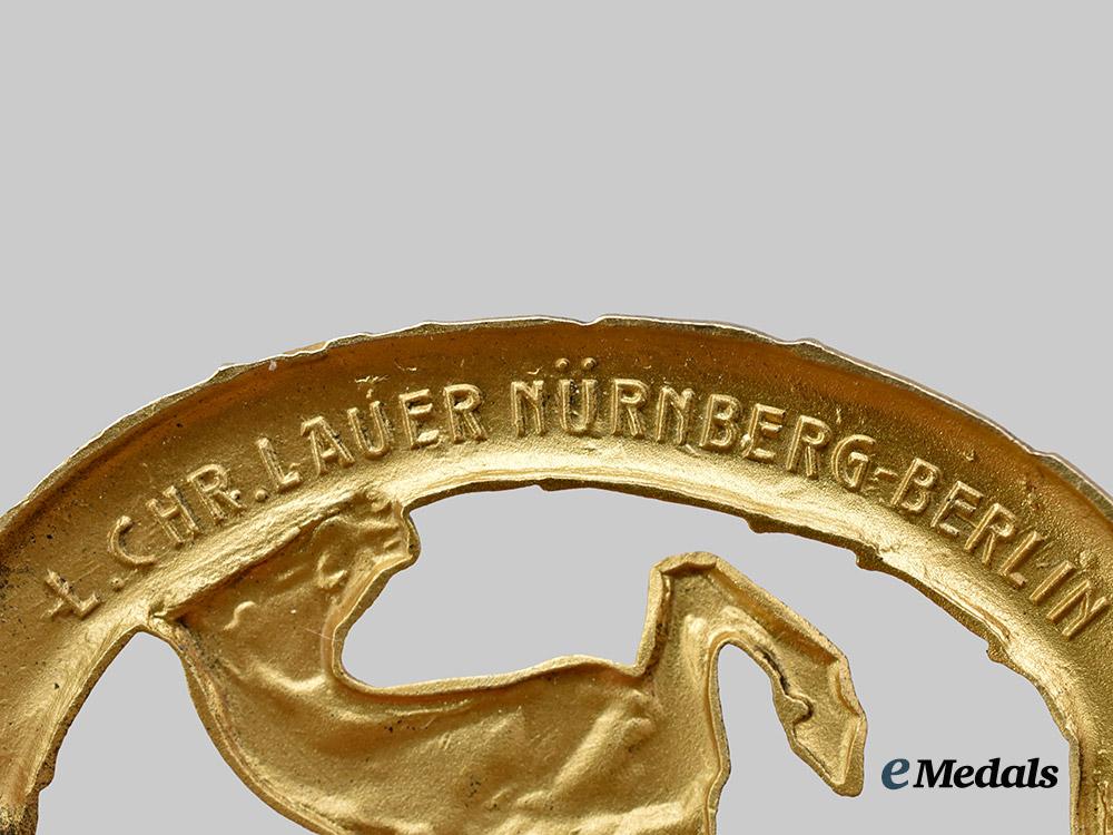 germany,_third_reich._a_rare_and_mint_german_horseman’s_badge,_gold_grade_with_miniature_and_case,_by_l._christian_lauer___m_n_c8274