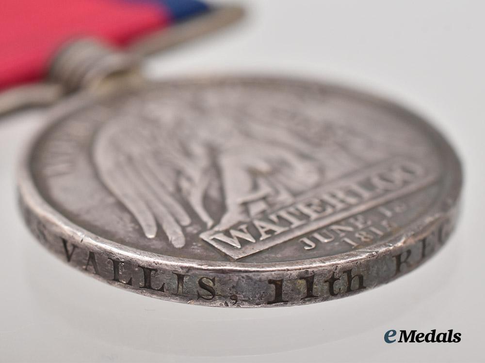 united_kingdom._a_waterloo_medal_to_private_james_vallis,11th_regiment,_light_dragoons___m_n_c8370