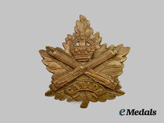 Canada, CEF. An Eaton Motor Machine Gun Battery Cap Badge, Maple Leaf Crossed Guns Design